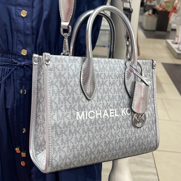 Michael Kors Handbags - Michael Kors Mirella Small Metallic Signature Logo Crossbody Bag 
Silver 
NWT